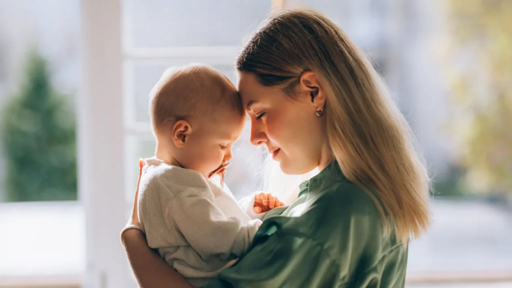 A photo of a mother holding her baby
