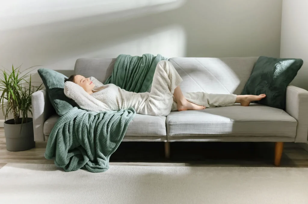 A woman relaxing on the couch